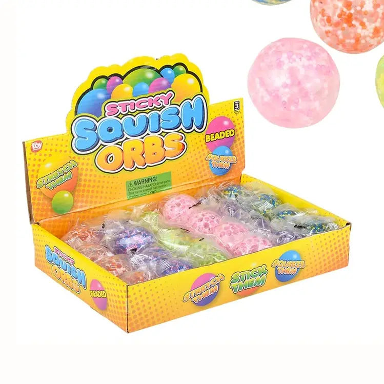 Display box of colorful 1.6 inch sticky squish orb beaded stress balls in assorted colors and patterns
