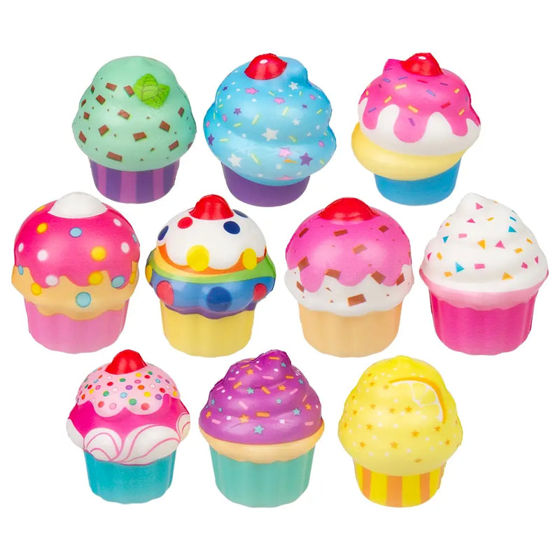 Assorted colorful 2 inch cupcake squish stress toys with frosting, sprinkles, and bright cupcake designs on a light background