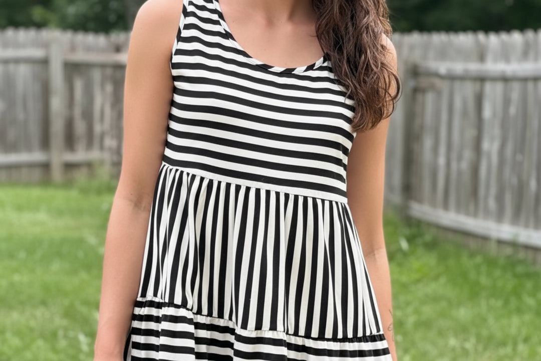 Black and white striped flowy dress perfect for Summer outings.