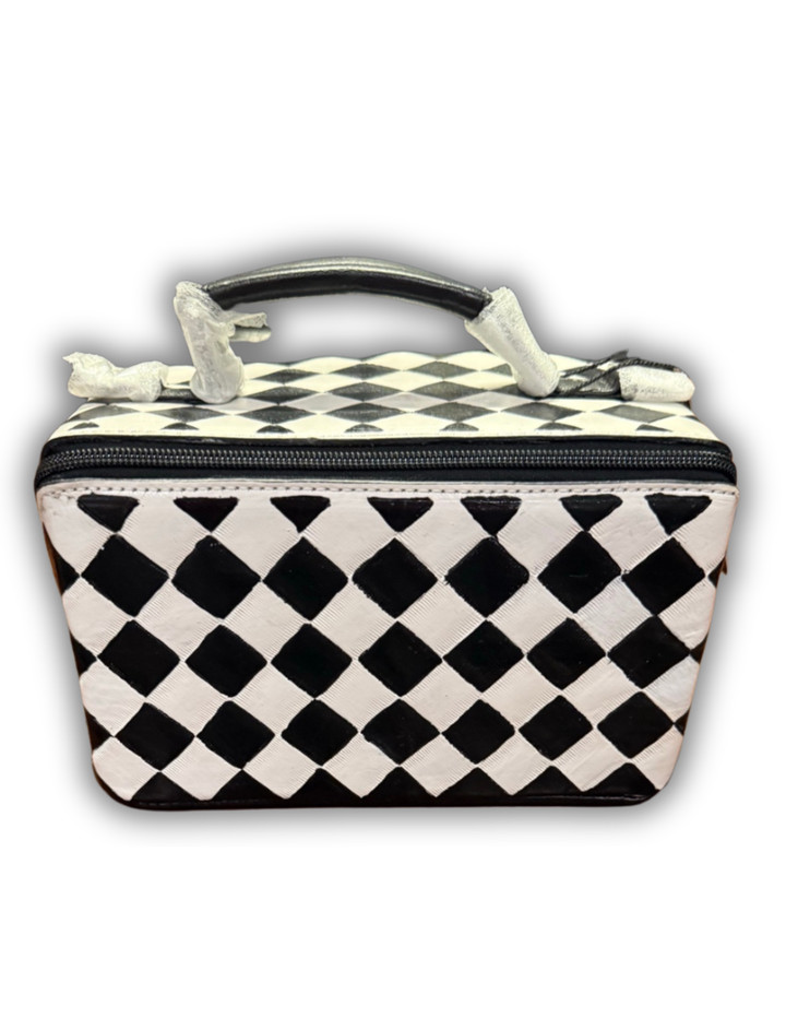 Checkered vanity travel bag with angled zipper opening and top carry handle