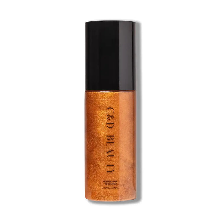 C&amp;D Beauty Golden Glow Body Spray featuring a shimmering golden formula in a sleek spray bottle designed to provide radiant, hydrated skin with a tropical pineapple and coconut fragrance.