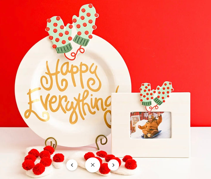 White ceramic holiday tableware set including a plate with gold &