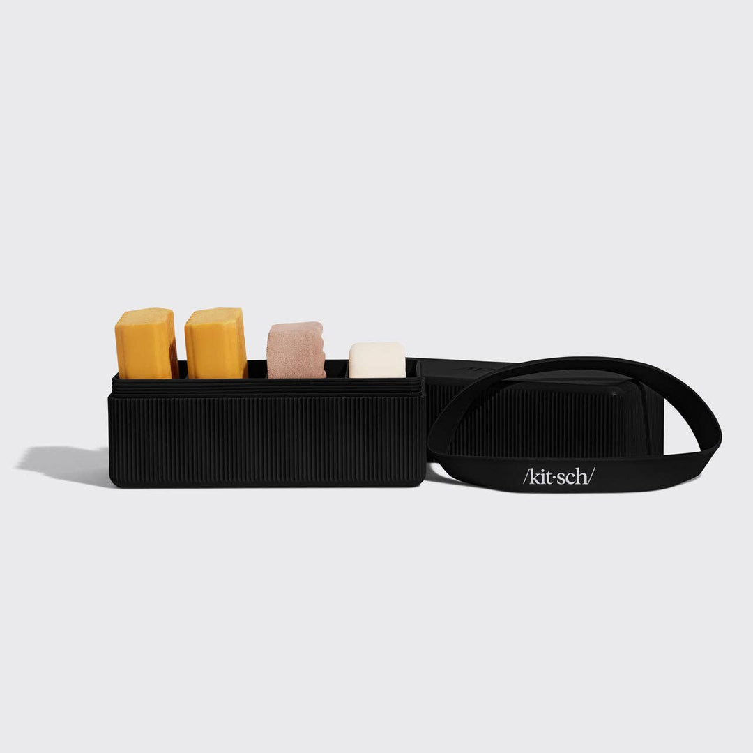 Black makeup bag with colorful lip balm tubes on a white background, featuring the 'kitsch' brand.