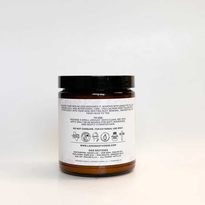 Lavender Thorne Restore Tallow Body Butter in an amber glass jar featuring a deeply moisturizing formula made with grass-fed beef tallow and calming lavender essential oil.