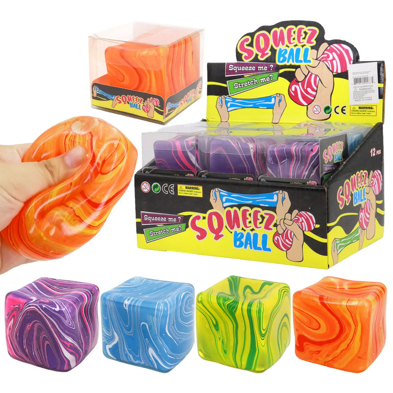 Assorted marbled cube putty filled squishy toys in purple, blue, green, and orange with retail display packaging