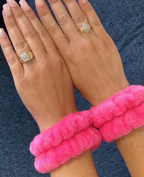 plush spa wrist bands pink on wrists preventing water drip