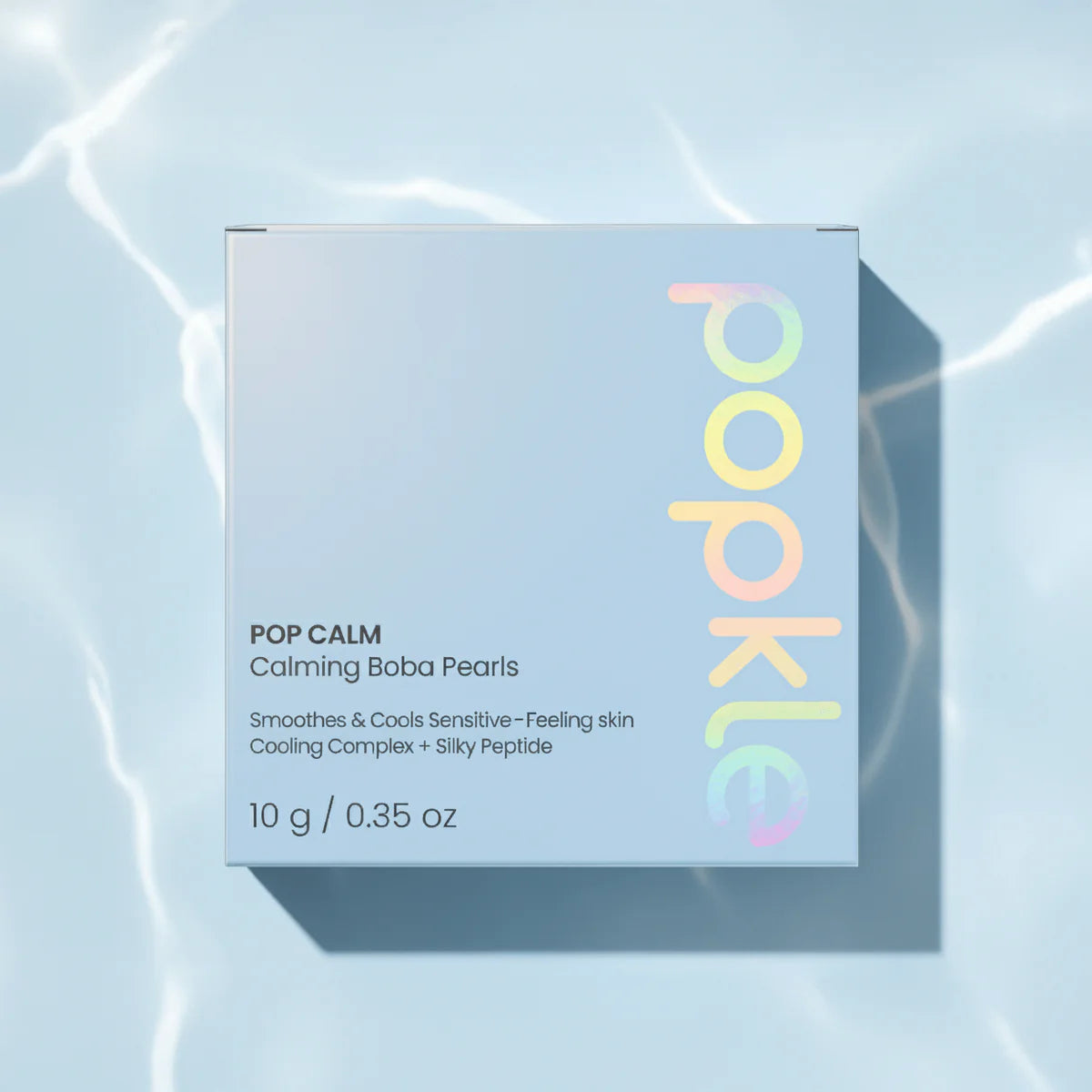 Pop Calm product packaging on a light blue background