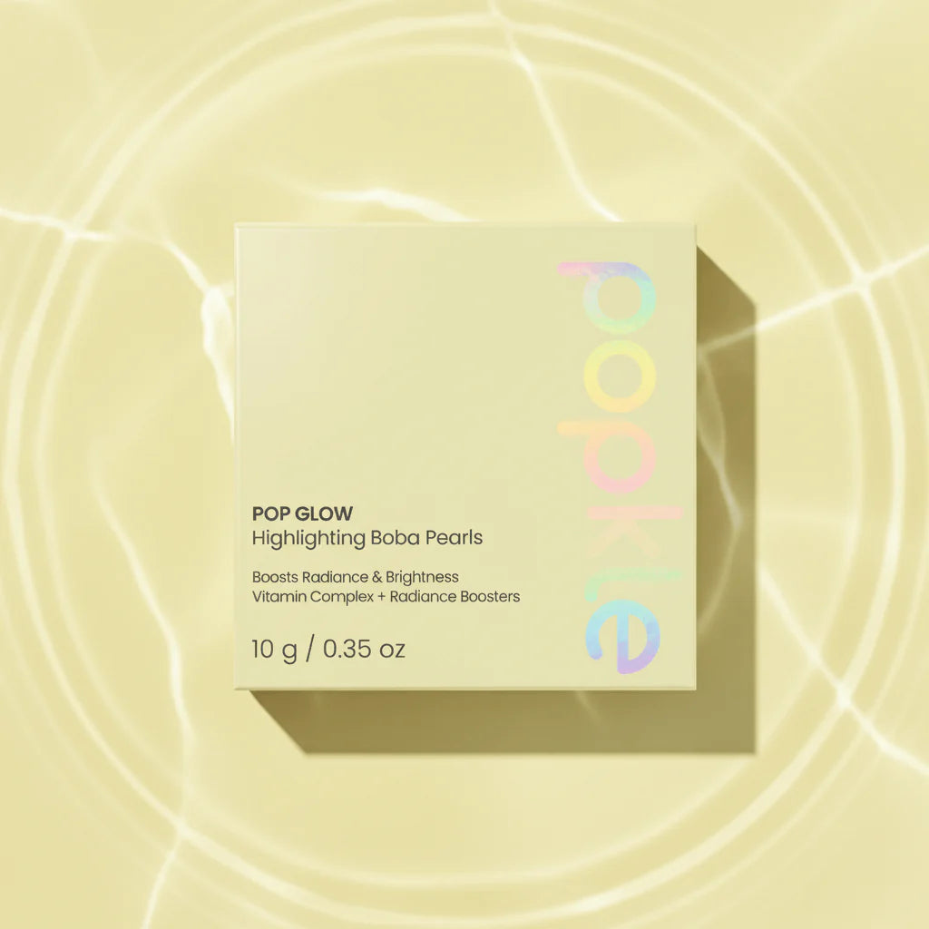 Box of Pop Glow Highlighting Boba Pearls on a yellow background