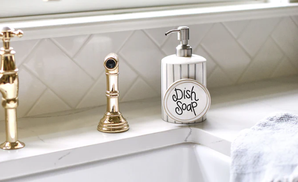 Happy Everything stone stripe mini cylinder soap pump with interchangeable mini attachment displayed on kitchen counter With write on attachment