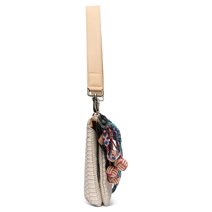 Side profile of Consuela Thunderbird Metro Crossbody showing slim design and leather strap