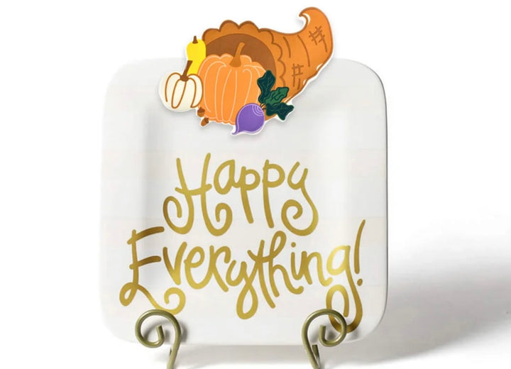 A square white decorative sign with rounded corners, featuring the phrase &
