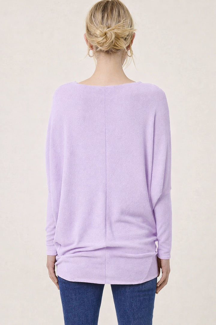 Back view of lavender dolman sleeve top with relaxed silhouette