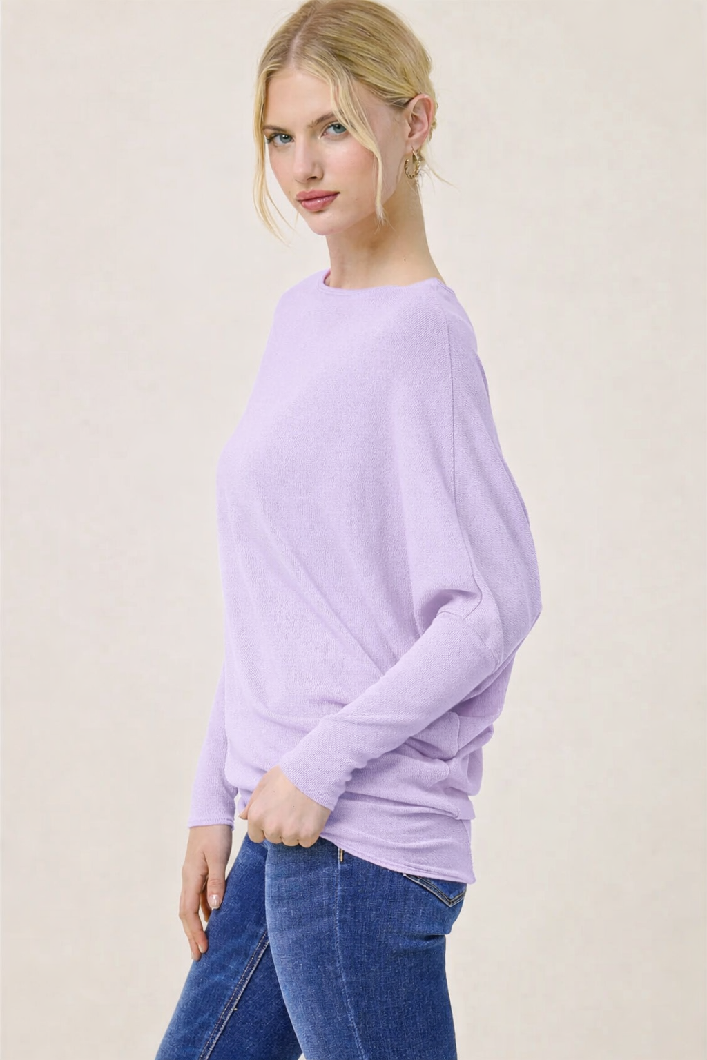 Side view of lavender dolman top showing flowy fit and stretch fabric