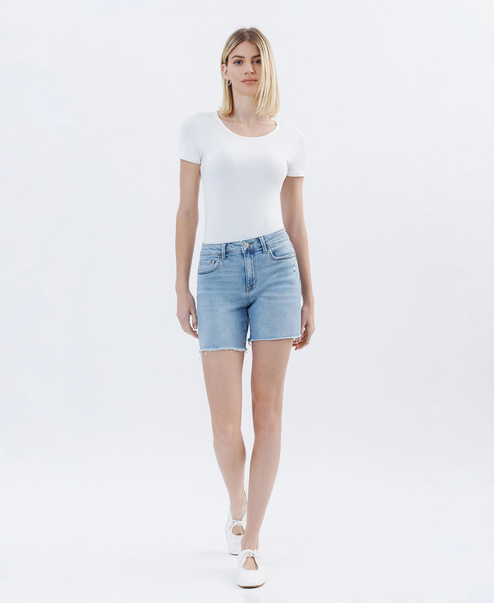 Front view of Lovervet by Vervet high rise raw hem midi denim shorts in a light wash