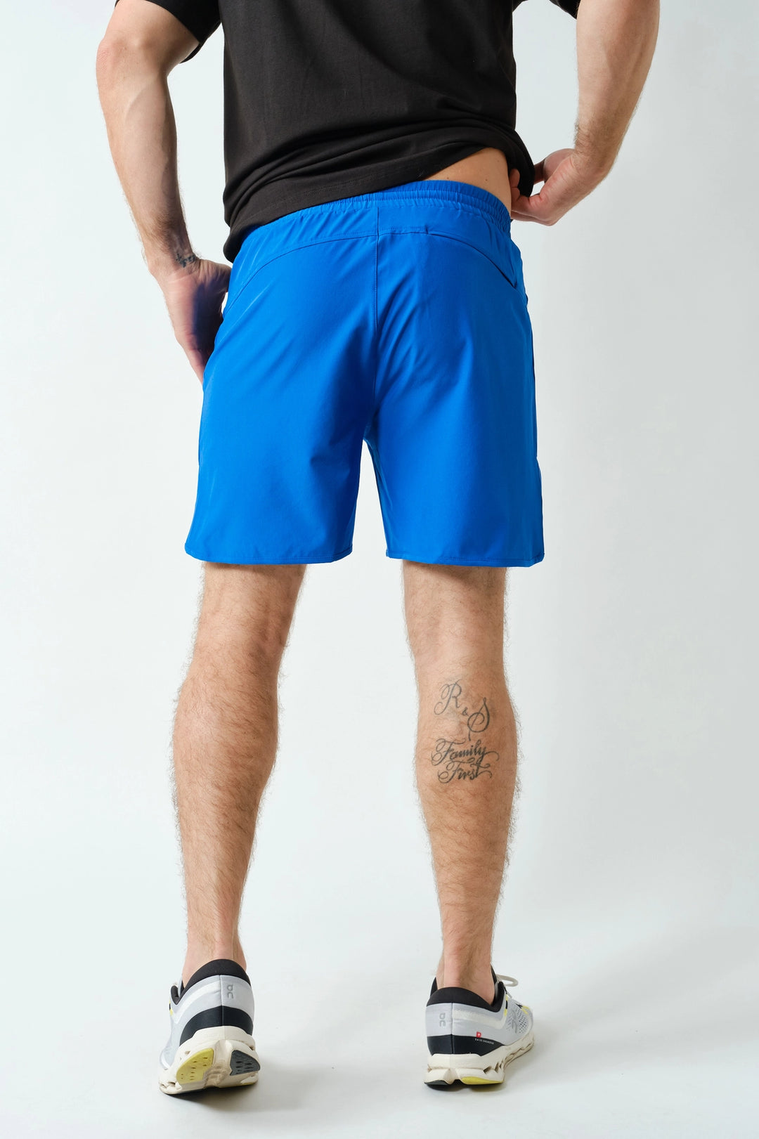 Back view of men’s blue athletic shorts with breathable lightweight fabric
