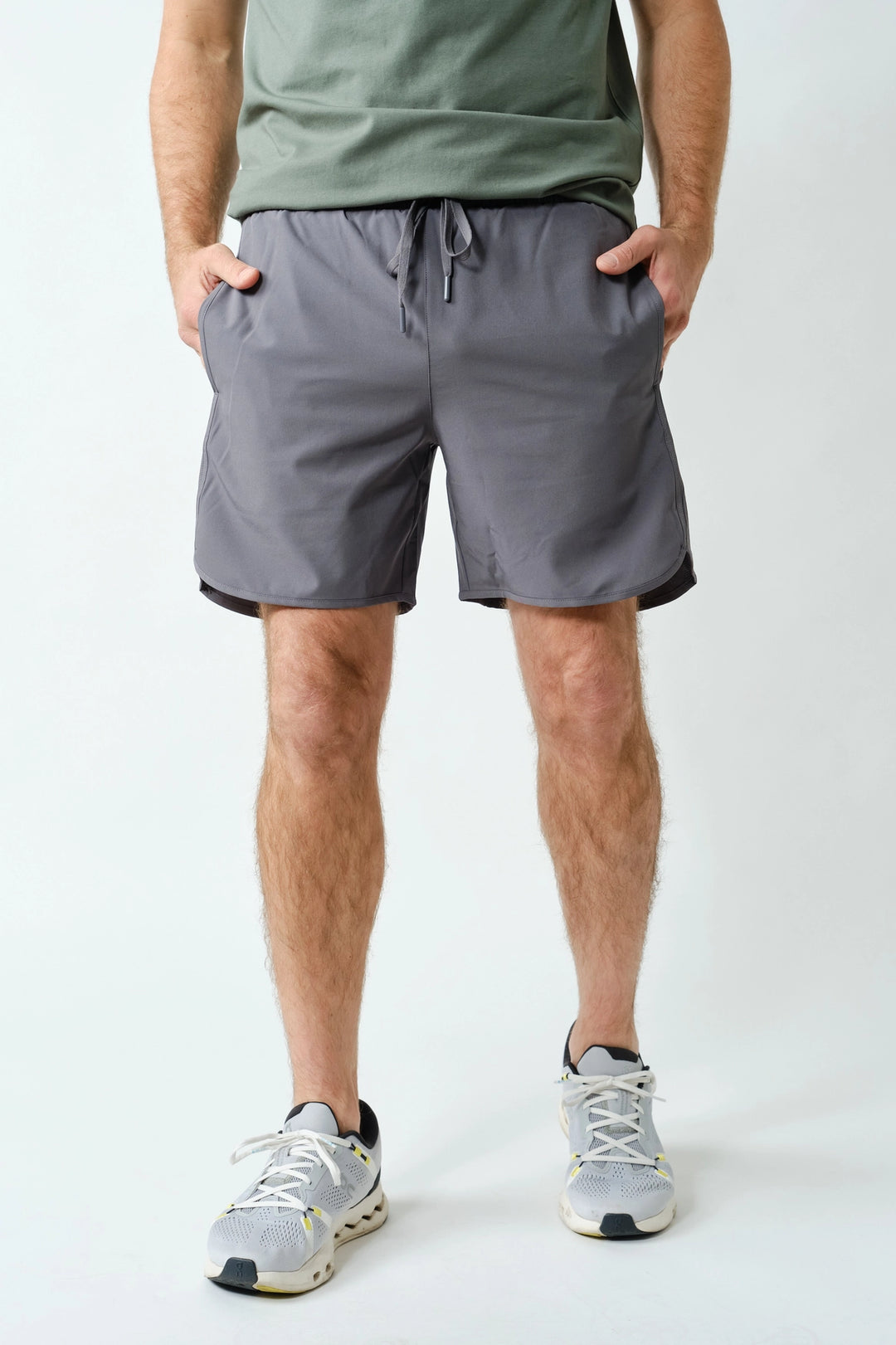 Men’s gray performance shorts front view with drawstring waistband and athletic fit