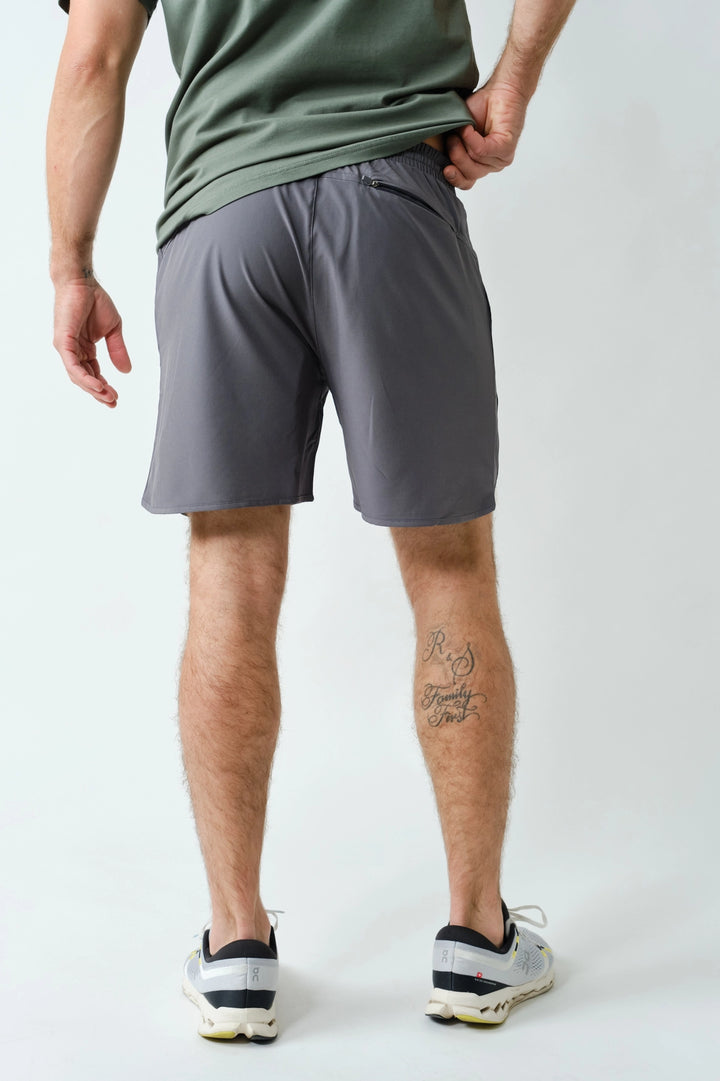 Back view of men’s gray performance shorts with elastic waistband