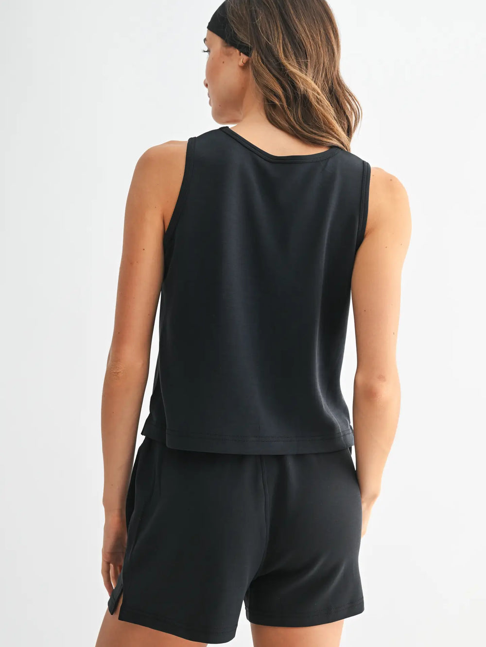 Back view of black Mono B tank and shorts set with relaxed silhouette