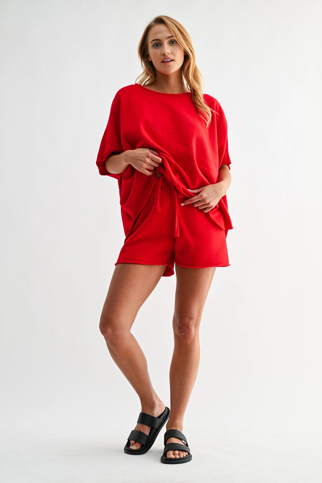 : Red Mono B lounge shorts styled with matching top for casual outfit
