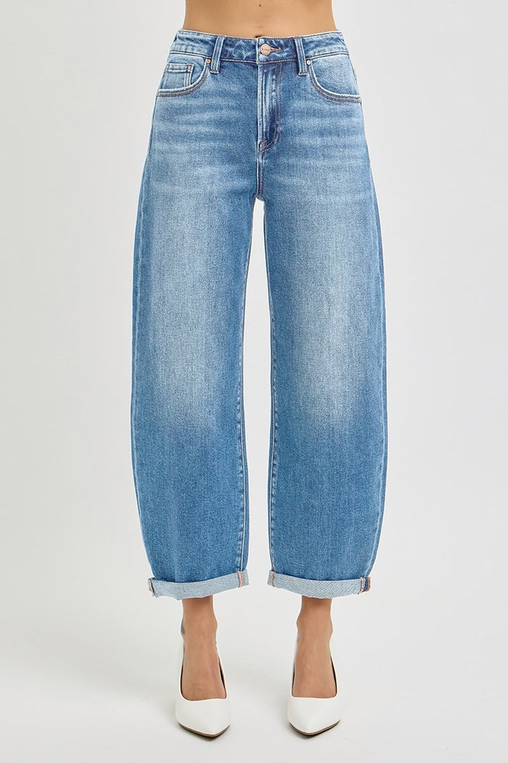 Front view of Risen High Rise Crop Mild Barrel Jeans in a light wash featuring a cuffed hem and trendy barrel leg design.