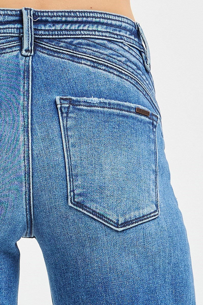 Close-up of the unique curved waistband detail on the Risen High Rise Wide Leg Jeans.