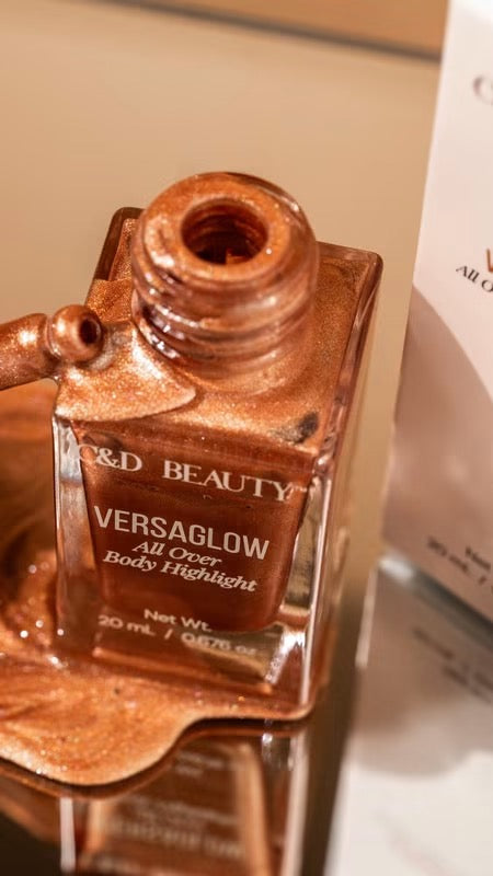 VersaGlow All Over Body Highlight bottle with luxury packaging displayed on a clean neutral background.